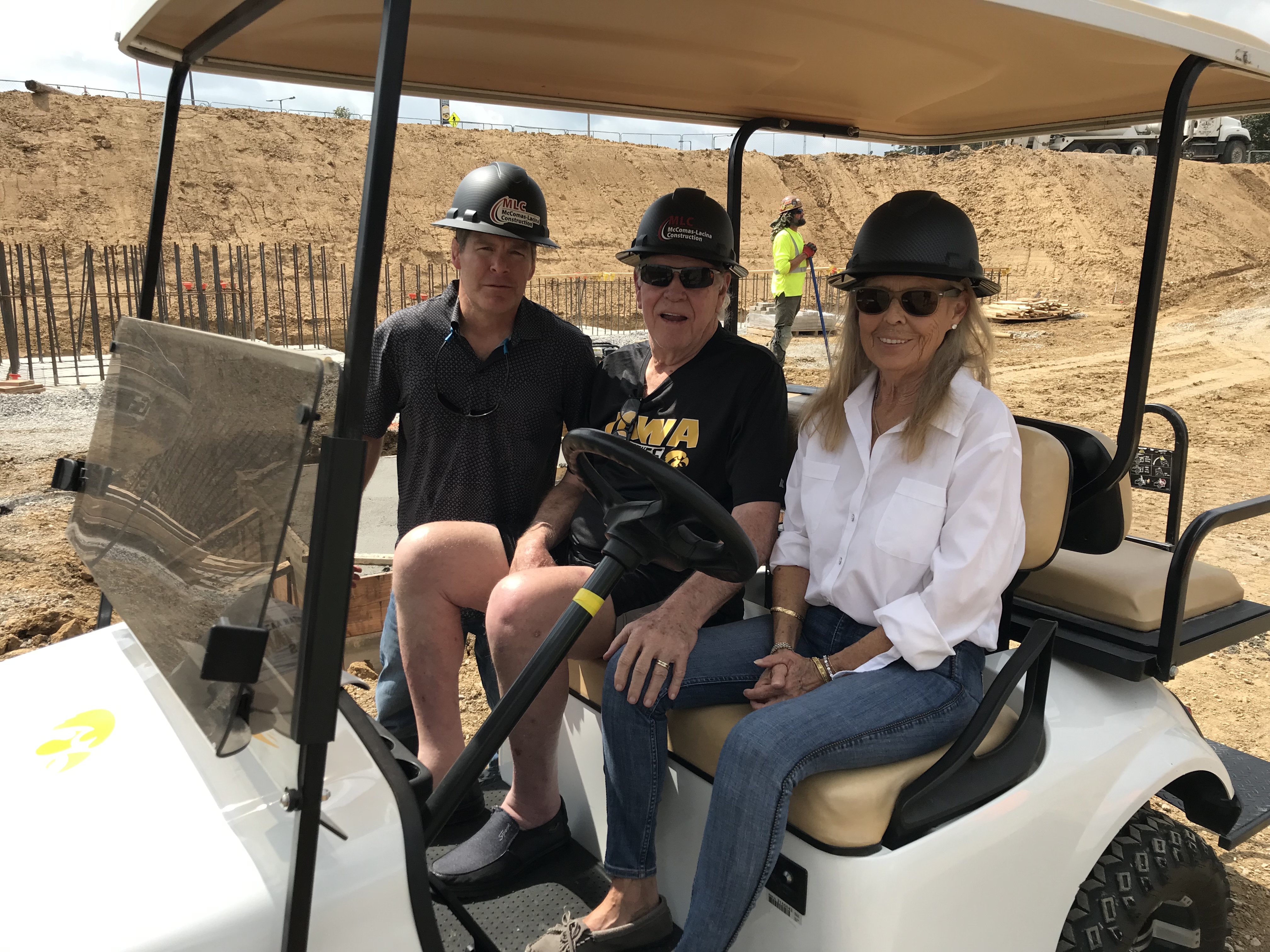 Tom Brands, Iowa men's wrestling head coach, gives Doug and Ann Goschke, of Iowa City, a tour of the construction site at the proposed Goschke Family Wrestling Training Center. 