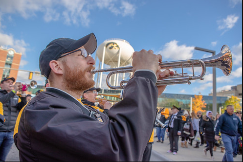 Prompt B, a man playing the trumpet